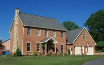 2 story brick farm house with attached 2 car garage